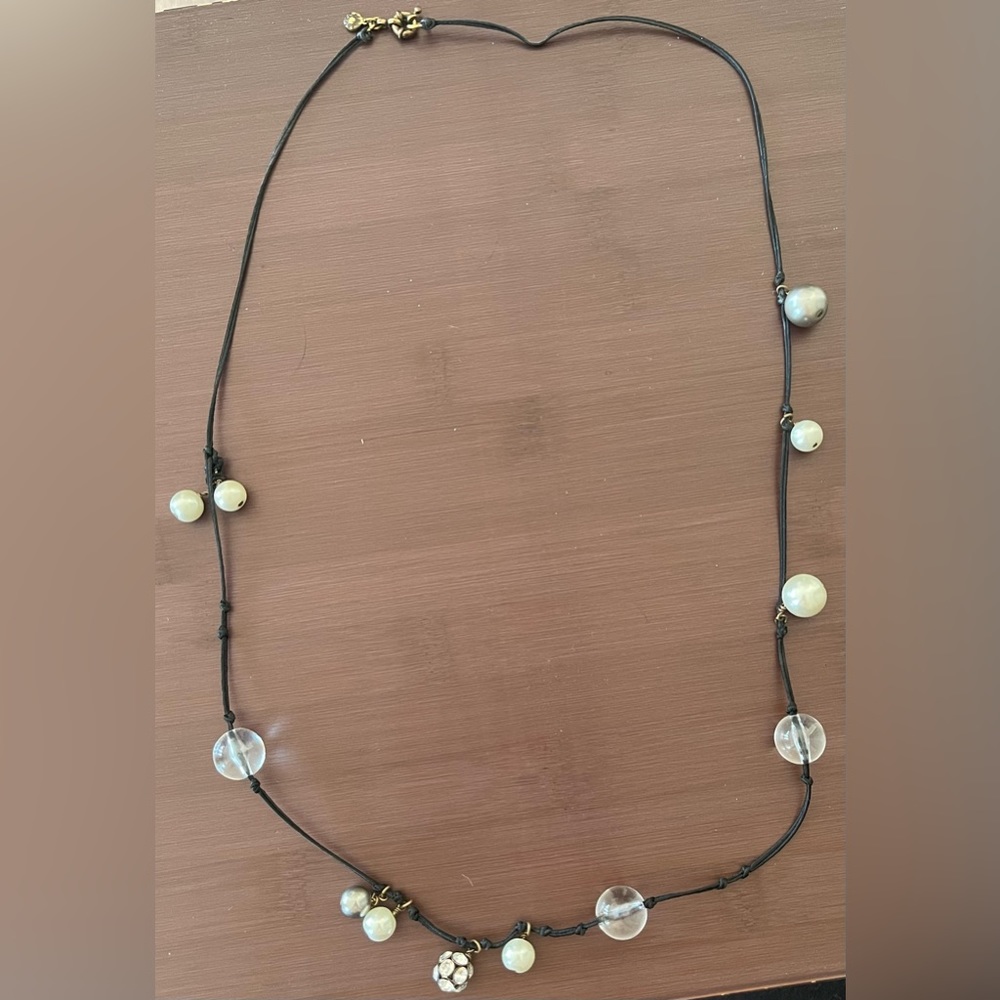 Long black cord necklace with clear and pearl-like charms